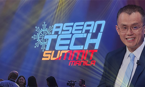 Speaker in a suit on stage at the ASEAN Tech Summit Manila, with the event logo and blue-purple lighting in the background.